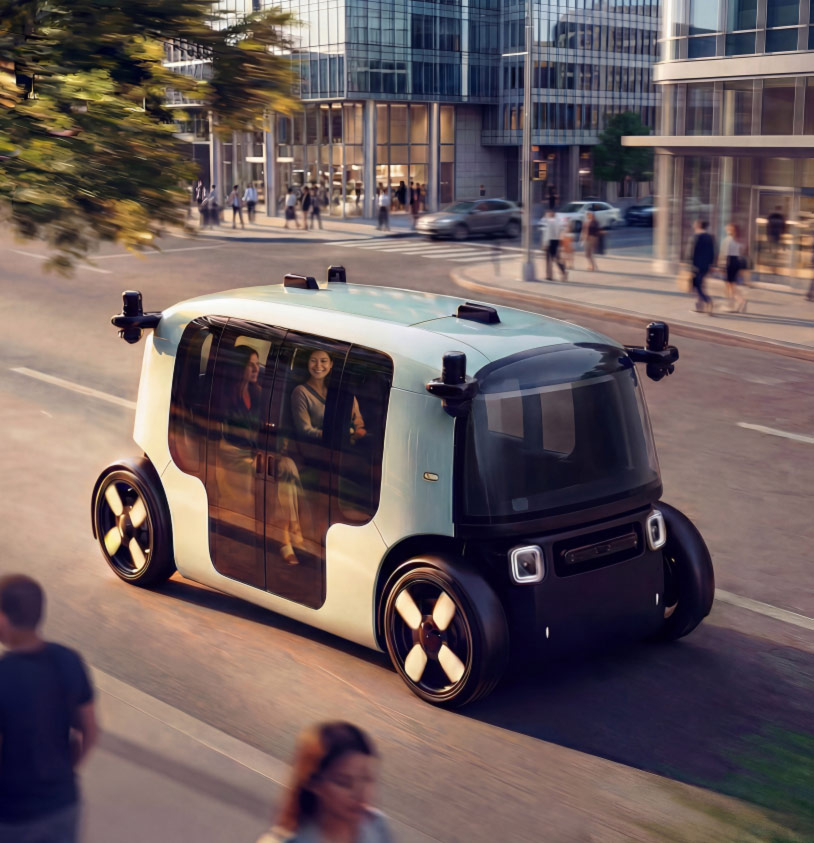 An autonomous minibus on a street with pedestrians on the sidewalks nearby and dappled light coming through a tree.